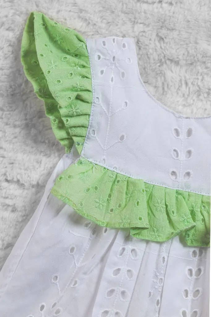 White and pastel green hacoba ruffled frock with butterfly sleeve 2.webp