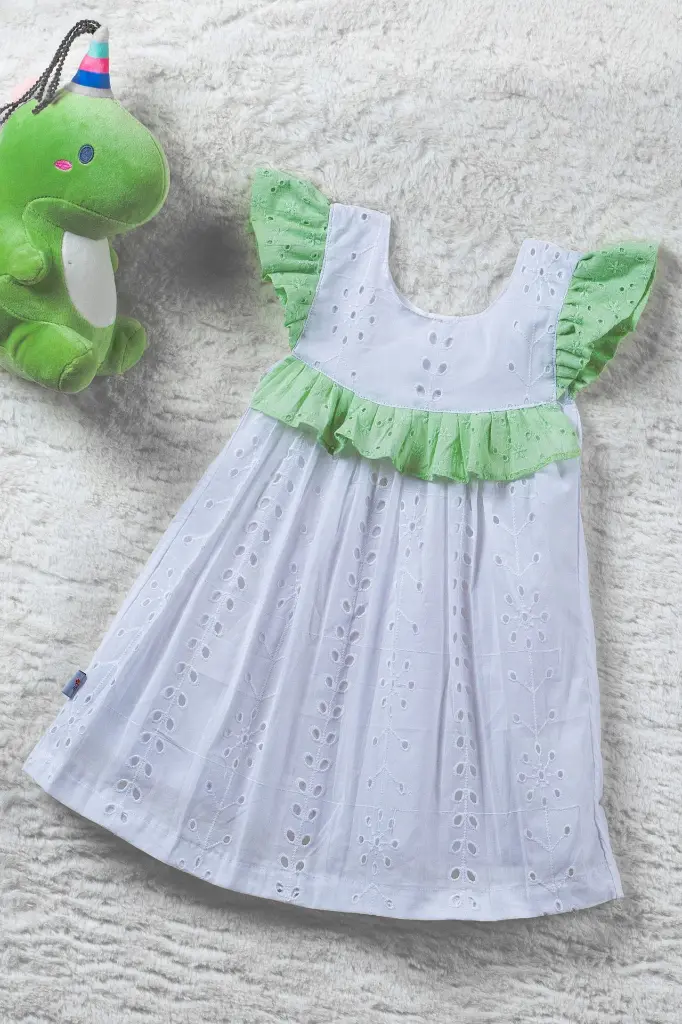 White and pastel green hacoba ruffled frock with butterfly sleeve 3.webp